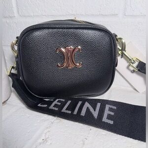 Black vegan leather fashion bag. Well made. Comes with 2 different straps.